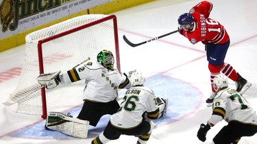 Dylan Robinson of the Oshawa Generals, left unattended just outside the Knights crease buries a rebound behind Knights goaltender Joseph Raaymakers for the only goal of the first period of their game at Budweiser Gardens on Friday October 19, 2018.  Mike Hensen/The London Free Press/Postmedia Network