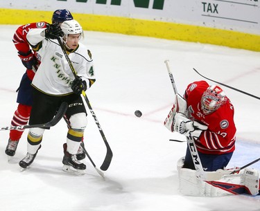 Sergey Popov of the Knights looks to get to a high shot blocked by Oshawa Generals' goaltender Kyle Keyser in the first period of their game at Budweiser Gardens on Friday October 19, 2018.  Mike Hensen/The London Free Press/Postmedia Network