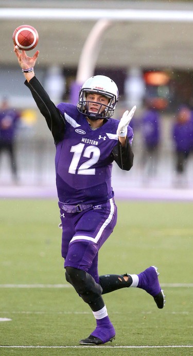 Western quarterback Chris Merchant throws on a roll out to his right early in the Western Homecoming game on Saturday October 20, 2018 at TD stadium.
The Mustangs won 46-13 after a strong second half against the Golden Hawks, leaving them undefeated for the season.
Mike Hensen/The London Free Press/Postmedia Network