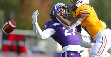 Western cornerback Mackenzie Ferguson gets in the way of a pass intended for Laurier wide receiver Kurleigh Gittens Jr. in the Western Homecoming game on Saturday October 20, 2018 at TD stadium.
The Mustangs won 46-13 after a strong second half against the Golden Hawks, leaving them undefeated for the season.
Mike Hensen/The London Free Press/Postmedia Network