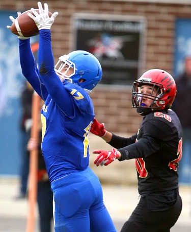 Ian Proszowski, of Beal secondary school, steps in front of a pass intended for Jacob Diponio of Saunders for an interception during their TVRA Central quarter final playoff game at Beal on Wednesday, Oct. 24, 2018. 
Mike Hensen/The London Free Press