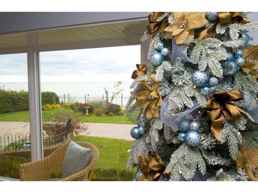 Traditional holiday colours of red and green don't suit blue decor or the lake views at 204 Adelaide St., Port Stanley, part of the holiday home tour. Instead, the designer used sand and surf shades to create a winter wonderland. Mike Hensen/The London Free Press