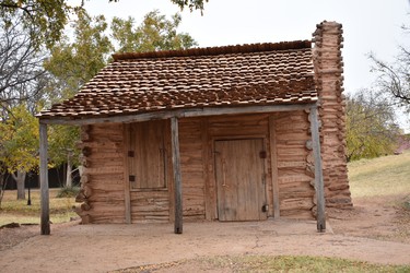 The El Capote Cabin, circa 1838, from Guadalupe County, is made of winged elm logs chinked together with mud. The National Ranching Heritage Center in Lubbock, Texas features almost 50 historical structures from the state's early days of ranching. 

BARBARA TAYLOR/THE LONDON FREE PRESS
Lubbock, Texas