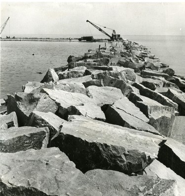 Port Dover's $600,000 harbor expansion now has the appearance of a rocky Lake Erie shoal that has some stranded construction machinery on it, 1967. (London Free Press files)