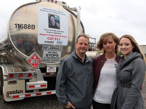 David and Shauna Andrews, and their daughter Sara Andrews, stand next to a tanker trailer bearing a decal that includes a photo of their son and brother Cody Andrews. He was killed by an impaired driver in London in 2016. The trailer is one of 40 in Ontario to which the trucking company RTL-Westcan is attaching decals as part of a public education effort with MADD Canada. Paul Morden/Sarnia Observer/Postmedia Network