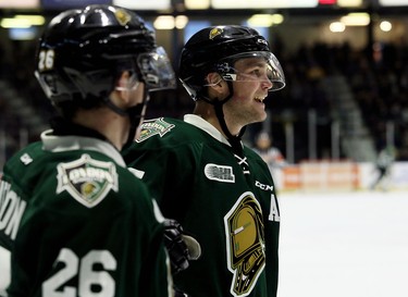 London Knights' Cole Tymkin, right, celebrates a go-ahead goal by Josh Nelson (26) against the Sarnia Sting during the second period of their game Sunday, Oct. 21 at Progressive Auto Sales Arena in Sarnia. (Mark Malone/Postmedia Network)