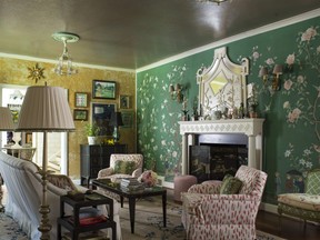 Madcap Cottage designers Jason Oliver Nixon and John Loecke love reupholstering and slipcovering vintage furniture as is evident in their living room in High Point, N.C.  (JOHN BESSLER PHOTO)