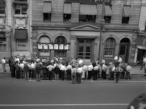 A crowd gathers around the London Free Press office on Richmond Street awaiting election results on June 27, 1949. In those days, voters often had
to wait until the newspaper printed and posted pages on its facade to learn who won. (The London Free Press Collection of photographic negatives, Western University Archives)