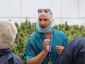 WeedMD chief executive Keith Merker speaks to guests touring the company's Strathroy greenhouse on Thursday, Aug. 6, 2018. (DALE CARRUTHERS, The London Free Press)