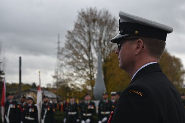 Petty Officer 1st Class David Moulton, a trombone player with the Royal Canadian Navy's Stadacona Band in Halifax, stands before the newly unveiled George Price memorial in Le Roeulx, Belgium Nov. 10, 2018. Price, a conscripted Canadian soldier, was the final Commonwealth soldier to be killed in the First World War. (Jennifer Bieman/The London Free Press)