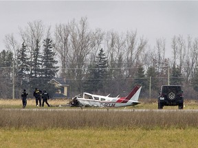 Ontario Provincial Police and the Transport Safety Board of Canada investigators are on scene at Brantford Municipal Airport on Tuesday morning November 13, 2018 following an overnight crash involving a Piper Arrow private aircraft in Brantford, Ontario. Two occupants of the plane were killed in the crash. (Brian Thompson/Postmedia Network)