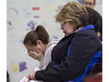 Family members weep during a news conference on the Six Nations of the Grand River Territory on Thursday November 15, 2018. Three Six Nations residents were found slain in the Municipality of Middlesex Centre, near London, earlier this month, and police are appealing for those with information to come forward. Brian Thompson/Brantford Expositor/Postmedia Network