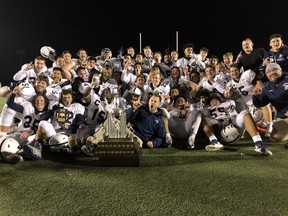 The Catholic Central Crusaders celebrate after defeating the Lucas Vikings 41-27 Monday night in the WOSSAA football championship game at TD Stadium.
(Paul Vanderhoeven/The London Free Press)