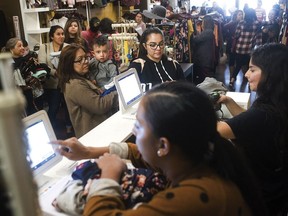 Black Friday shoppers fill Zambukas on Main Street in Porterville, Calif., Friday, Nov. 23, 2018. (Chieko Hara/The Porterville Recorder via AP)