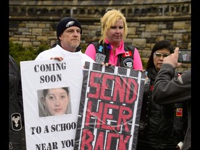 Rodney Stafford, left, father of Tori Stafford, poses for a photo with supporters during a 'Justice for Tori' protest on Parliament Hill in Ottawa on Friday.