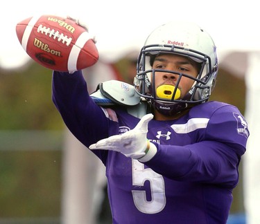 Western running back Alex Taylor shows off the ball after he made a endzone catch for a touchdown making the score 29-6 over Carleton late in the third quarter of their semi-final Saturday November 3, 2018 at Td stadium.
Western won 39-13 and will move on to face Guelph next week at home for the Yates Cup.
Mike Hensen/The London Free Press/Postmedia Network