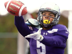 Western running back Alex Taylor shows off the ball after he made a endzone catch for a touchdown making the score 29-6 over Carleton late in the third quarter of their semi-final Saturday November 3, 2018 at Td stadium.
Western won 39-13 and will move on to face Guelph next week at home for the Yates Cup.
Mike Hensen/The London Free Press/Postmedia Network