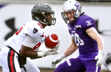 Western defensive back Jake Andrews can't get to Carleton receiver Phil Iloki in time to break up a pass from Raven's qb Mike Arruda early in their semi-final Saturday November 3, 2018 at Td stadium.
Western won 39-13 and will move on to face Guelph next week at home for the Yates Cup.
Mike Hensen/The London Free Press/Postmedia Network