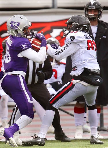 Western cornerback Bleska Kambamba wrests the pass away from Carleton receiver Chad Marchulenko for an interception during their semi-final Saturday November 3, 2018 at Td stadium.
Western won 39-13 and will move on to face Guelph next week at home for the Yates Cup.
Mike Hensen/The London Free Press/Postmedia Network