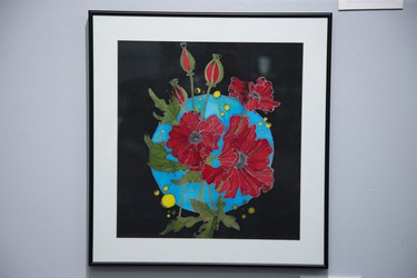 Poppies In Blue by Glenna Stenning is one of the pieces featured in  "100 Years In The Making"  an exhibit featuring artwork by the veterans of Parkwood Institute at Art With Panache Gallery.  Derek Ruttan/The London Free Press/Postmedia Network