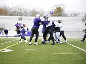 The Western Mustangs football team works on plays Tuesday at TD Stadium in preparation for the Yates cup game against the Guelph Gryphons there on Saturday. (Derek Ruttan/The London Free Press)