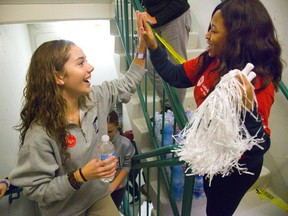 Nora Moir-Beazely, of CCH gets a cheer and a high five from United Way volunteer Doris Echeonwu, who was on hand on the 25th floor of One London Place to give high fives and celebrating with people who have just climbed the office tower stairs raising money for the United Way. The United Way hopes to raise $250,000 from students and members of the public climbing the 472 steps. Mike Hensen/The London Free Press/Postmedia Network