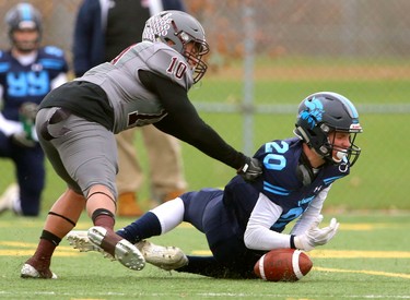 Lucas receiver Sam Spoelstra can't make the catch on a low pass as he's covered by South's Jonah Lopez during their TVRA Central championship game at the City Wide fields on Thursday November 8, 2018.  After a 1-1 first half where both teams made great stops, and missed field goals, South went ahead 8-1 in the fourth only to be matched immediately by Lucas making the game 8-8. A late run by Lucas'Nicholas Barnes sealed the deal at 14-8 as both teams stuggled to move the ball and each team had a massive amount of penalties. Mike Hensen/The London Free Press/Postmedia Network