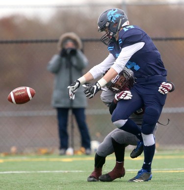 South's Jacob Saunders knocks the ball loose from Lucas receiver Patrick Murphy during their TVRA Central championship game at the City Wide fields on Thursday November 8, 2018.  After a 1-1 first half where both teams made great stops, and missed field goals, South went ahead 8-1 in the fourth only to be matched immediately by Lucas making the game 8-8. A late run by Lucas'Nicholas Barnes sealed the deal at 14-8 as both teams stuggled to move the ball and each team had a massive amount of penalties. Mike Hensen/The London Free Press/Postmedia Network