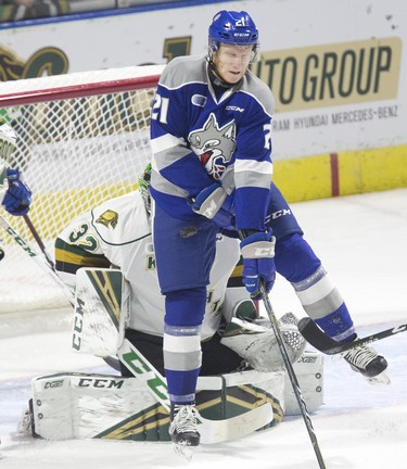 Sudbury Wolves winger Nolan Hutcheson fails to leap out of the way and gets hit in the leg by a point shot in front of London Knights goalie Joseph Raaymakers. Derek Ruttan/The London Free Press/Postmedia Network