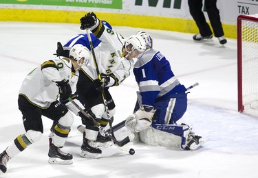 Unfortunately for the London Knights the referee lost sight of the puck and blew the whistle before Matvey Guskov (left) or Billy Moskal could put the puck past Sudbury Wolves goalie Ukko-Pekka Luukkonen. Derek Ruttan/The London Free Press/Postmedia Network