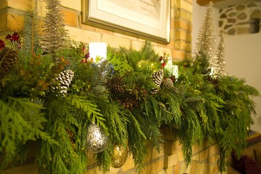 Parkway Gardens decorated this mantel in the stone cottage home of Andrew Mitchell near Kilworth west of London.  Mike Hensen/The London Free Press/Postmedia Network