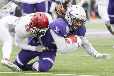 Western Mustang Cedric Joseph is tackled by Guelph Gryphon Dotun Aketepe  during the Yates Cup OUA championship game at TD Stadium in London, Ont. on Saturday November 10, 2018. Western won the game 63-14. Derek Ruttan/The London Free Press/Postmedia Network