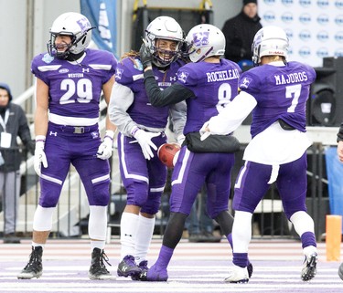 Western Mustangs Antonio Valvano (29) Francois Rocheleau and Cole Majoros celebrate with Cedric Joseph after his touchdown   during the Yates Cup OUA championship game at TD Stadium in London, Ont. on Saturday November 10, 2018. Western won the game 63-14. Derek Ruttan/The London Free Press/Postmedia Network