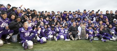 The Western Mustangs celebrate with the Yates Cup following the team's 63-14 win over the Guelph Gryphons in the  OUA championship game at TD Stadium in London, Ont. on Saturday November 10, 2018. Derek Ruttan/The London Free Press/Postmedia Network