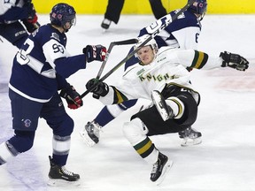 William Lochead of the London Knights is rocked by a mid ice collision with Jonathan Yantsis of the Kitchener Rangers during the second period of the their game at Budweiser Gardens on Sunday Nov. 11, 2018. Derek Ruttan/The London Free Press