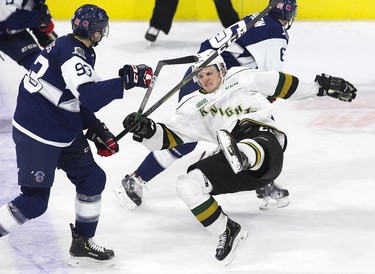 William Lochead of the London Knights is rocked by a mid ice collision with Jonathan Yantsis of the Kitchener Rangers during the second period of the their game at Budweiser Gardens in London, Ont. on Sunday November 11, 2018. Derek Ruttan/The London Free Press/Postmedia Network