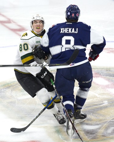 Alex Formenton of the London Knights gets the worst of a centre ice collision with Arber Xhekaj of the Kitchener Rangers during their game at Budweiser Gardens in London, Ont. on Sunday November 11, 2018. No penalty was called on the play. Derek Ruttan/The London Free Press/Postmedia Network