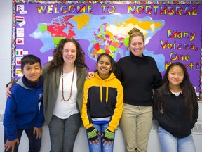 Northbrae teachers Jessica Albrecht and Laurie Welshman with some of their Nepalese students Saradhan Rai, Mahema Biswa and Samikchya Rai in London.  (Mike Hensen/The London Free Press)