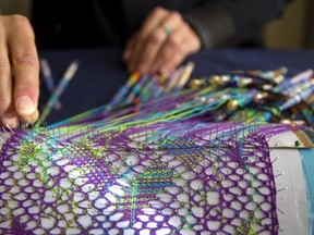 Kathy Morgan makes a bobbin lace creation in preparation for the Fibre Arts Festival in London Nov. 16-18. (Mike Hensen/The London Free Press)