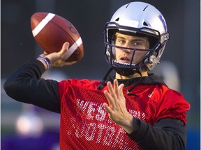 Western Mustangs quarterback Chris Merchant warms up during practice at TD Stadium on Tuesday as the team prepares to face the Saskatchewan Huskies Saturday in the Mitchell Bowl. (Mike Hensen/The London Free Press)