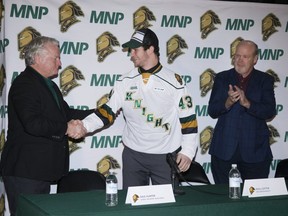 London Knights head coach Dale Hunter (left) and general manager Mark Hunter welcome Paul Cotter to the team during a morning press conference at Budweiser Gardens in London. (Derek Ruttan/The London Free Press)