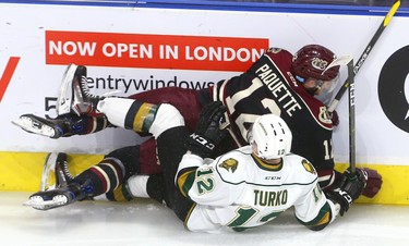 Alex Turko of the Knights and Christopher Paquette of the Petes get tied up in the Knights end during the first period of their game Friday November 16, 2018 at Budweiser Gardens. 
Mike Hensen/The London Free Press/Postmedia Network