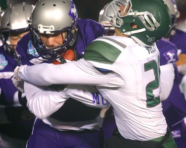 Francois Rocheleau of the Western Mustangs is tackled as he returns a punt by Nixon Voll of the Huskies.
The Mustangs fought to a 17-17 tie at the half with a Mark Liegghio field goal before taking control in the second half for a convincing 47-24 win punching their tickets for Quebec City next week against Laval in the Vanier Cup. 
Photograph taken on Saturday November 17, 2018.  
Mike Hensen/The London Free Press/Postmedia Network