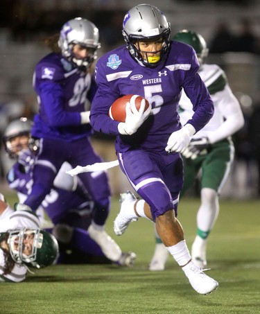 The Western Mustangs offence came to life in the second half of the Mitchell Bowl with the offensive line repeatedly opening holes for Alex Taylor (shown) and Cedric Joseph to open up a sizable lead over the Saskatchewan Huskies.
The Mustangs fought to a 17-17 tie at the half with a Mark Liegghio field goal before taking control in the second half for a convincing 47-24 win punching their tickets for Quebec City next week against Laval in the Vanier Cup. 
Photograph taken on Saturday November 17, 2018.  
Mike Hensen/The London Free Press/Postmedia Network