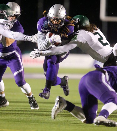 The Western Mustangs offence came to life in the second half of the Mitchell Bowl with the offensive line repeatedly opening holes for Alex Taylor and Cedric Joseph (shown) to open up a sizable lead over the Saskatchewan Huskies.
The Mustangs fought to a 17-17 tie at the half with a Mark Liegghio field goal before taking control in the second half for a convincing 47-24 win punching their tickets for Quebec City next week against Laval in the Vanier Cup. 
Photograph taken on Saturday November 17, 2018.  
Mike Hensen/The London Free Press/Postmedia Network