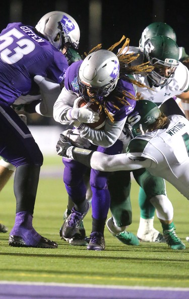 The Western Mustangs offence came to life in the second half of the Mitchell Bowl with the offensive line repeatedly opening holes for Alex Taylor and Cedric Joseph (shown) to open up a sizable lead over the Saskatchewan Huskies.
The Mustangs fought to a 17-17 tie at the half with a Mark Liegghio field goal before taking control in the second half for a convincing 47-24 win punching their tickets for Quebec City next week against Laval in the Vanier Cup. 
Photograph taken on Saturday November 17, 2018.  
Mike Hensen/The London Free Press/Postmedia Network