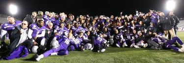 Mustangs pose with the Mitchell Bowl after the Mustangs rang up a convincing 47-24 win against the Saskatchewan Huskies punching their tickets for Quebec City next week against Laval in the Vanier Cup. 
Photograph taken on Saturday November 17, 2018.  
Mike Hensen/The London Free Press/Postmedia Network