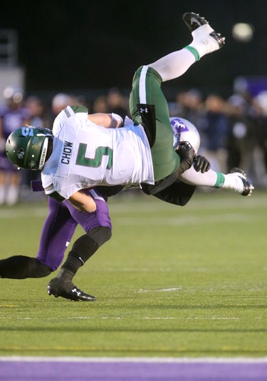 Tyler Chow of the Saskatchewan Huskies is upended by Jacob Andrews of the Mustangs near the Western endzone but it wasn't enough to sto the Huskies from getting another TD during the first half of the Mitchell Bowl played Saturday at TD stadium
The Mustangs fought to a 17-17 tie at the half with a Mark Liegghio field goal before taking control in the second half for a convincing 47-24 win punching their tickets for Quebec City next week against Laval in the Vanier Cup. 
Photograph taken on Saturday November 17, 2018. 
Mike Hensen/The London Free Press/Postmedia Network