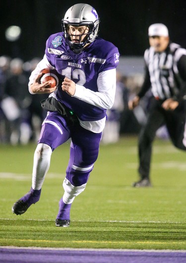 Western quarterback Chris Merchant gets some sweet revenge running in a touchdown after a tough first half, making the score 24-17 over the Saskatchewan Huskies during the Mitchell Bowl played Saturday at TD stadium
The Mustangs fought to a 17-17 tie at the half with a Mark Liegghio field goal before taking control in the second half for a convincing 47-24 win punching their tickets for Quebec City next week against Laval in the Vanier Cup. 
Photograph taken on Saturday November 17, 2018.  
Mike Hensen/The London Free Press/Postmedia Network