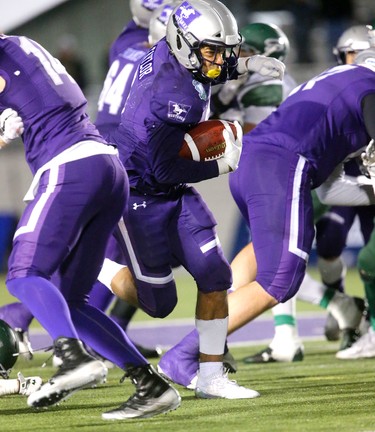 The Western Mustangs offence came to life in the second half of the Mitchell Bowl with the offensive line repeatedly opening holes fro Alex Taylor (shown) and Cedric Joseph to open up a sizable lead over the Saskatchewan Huskies.
The Mustangs fought to a 17-17 tie at the half with a Mark Liegghio field goal before taking control in the second half for a convincing 47-24 win punching their tickets for Quebec City next week against Laval in the Vanier Cup. 
Photograph taken on Saturday November 17, 2018.  
Mike Hensen/The London Free Press/Postmedia Network